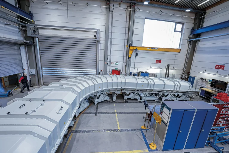 Enclosed, curved JOEST conveyor trough in final assembly