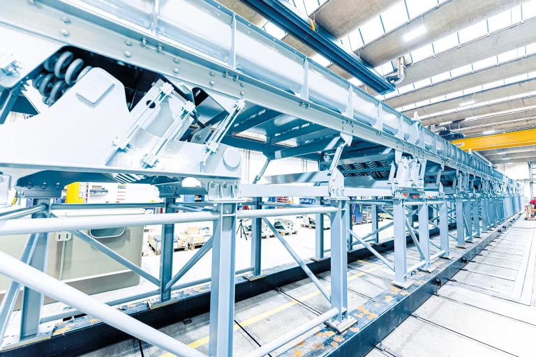 Detail view of JOEST conveyor trough with vibration elements and steel frame