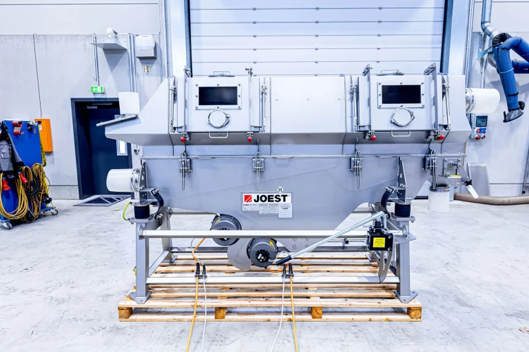 JOEST dryer with vibrating conveyor trough and inspection ports for thermal bulk material processing.