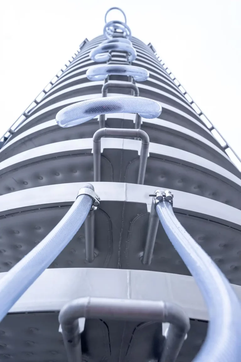 JOEST spiral elevator with helical trough and external piping for water cooling.