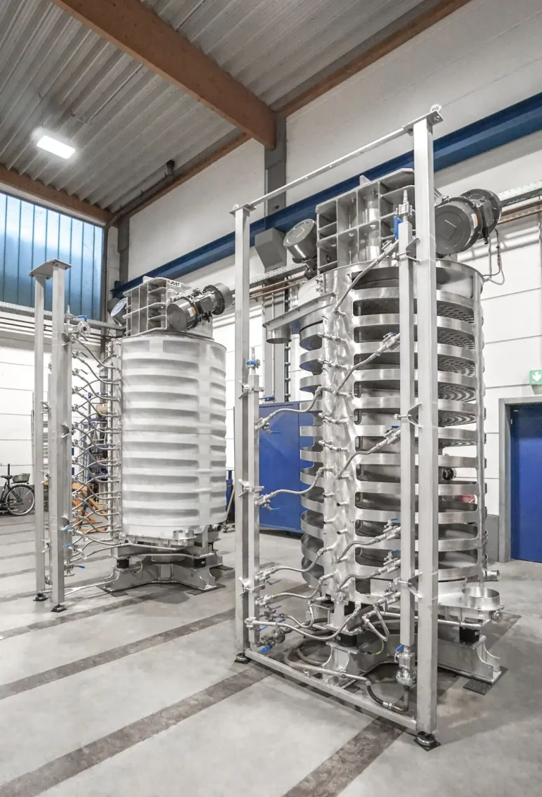 Two JOEST spiral elevators with water cooling, one open and one enclosed design.