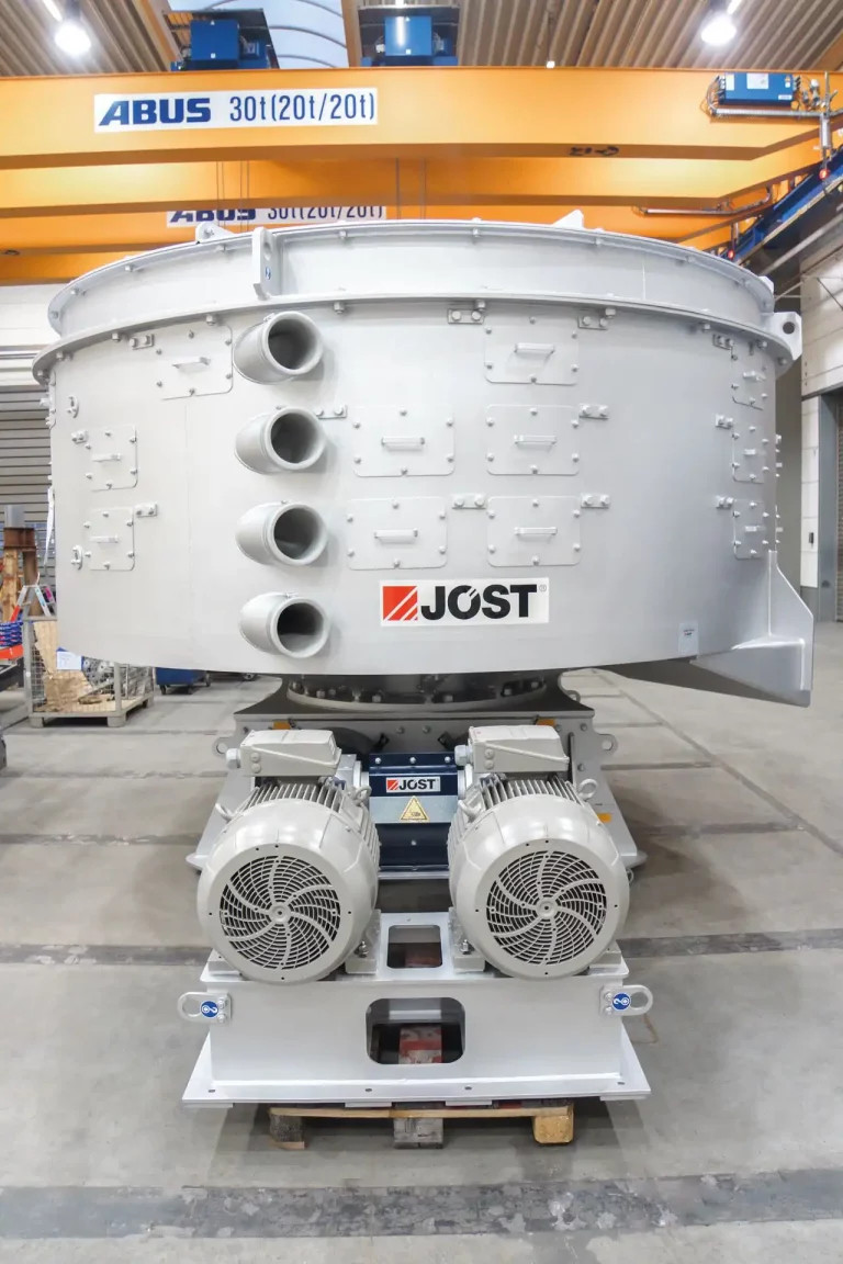 Encased spiral elevator by JOEST with compact design and integrated drive.